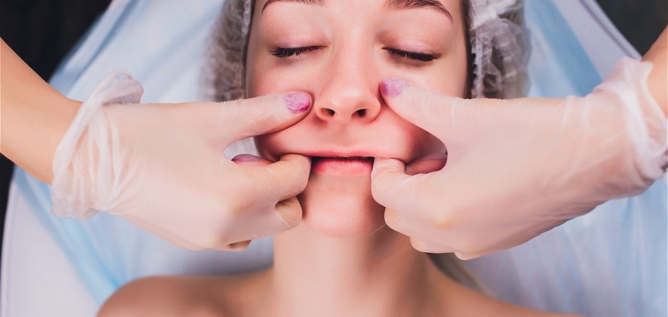 cosmetologist-makes-buccal-massage-patient-s-facial-muscles